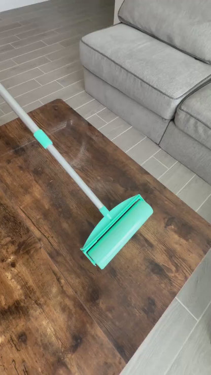 A roller cleaning a wooden table