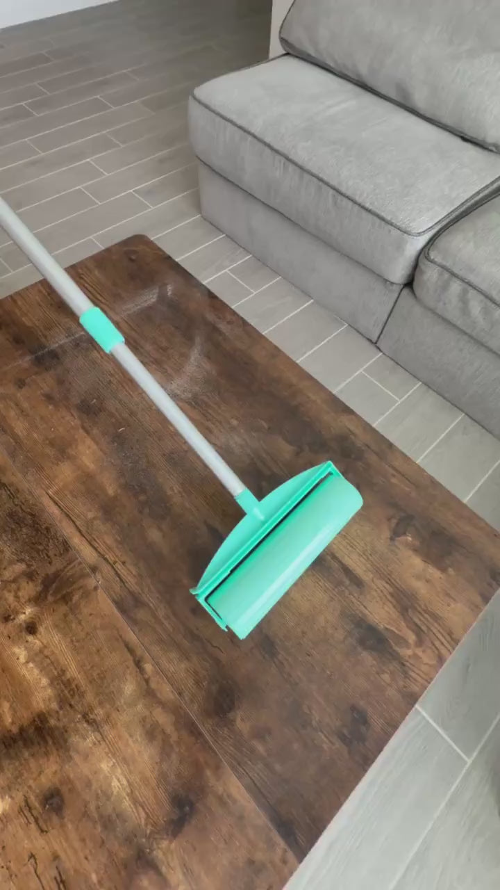 A roller cleaning a wooden table